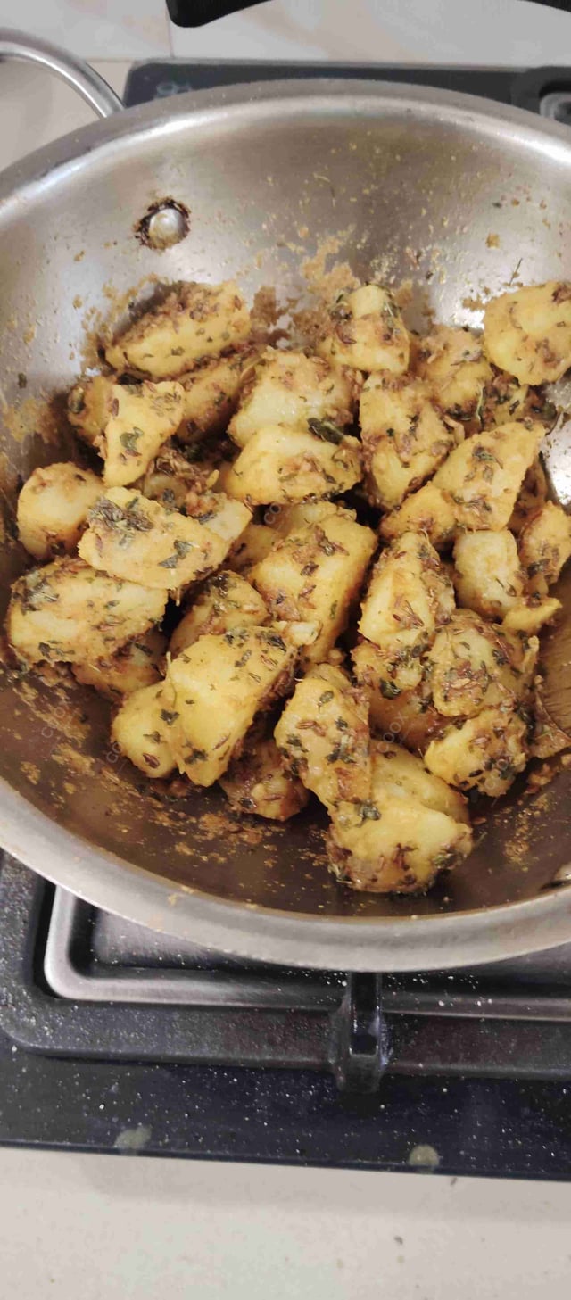 Delicious Jeera Aloo prepared by COOX