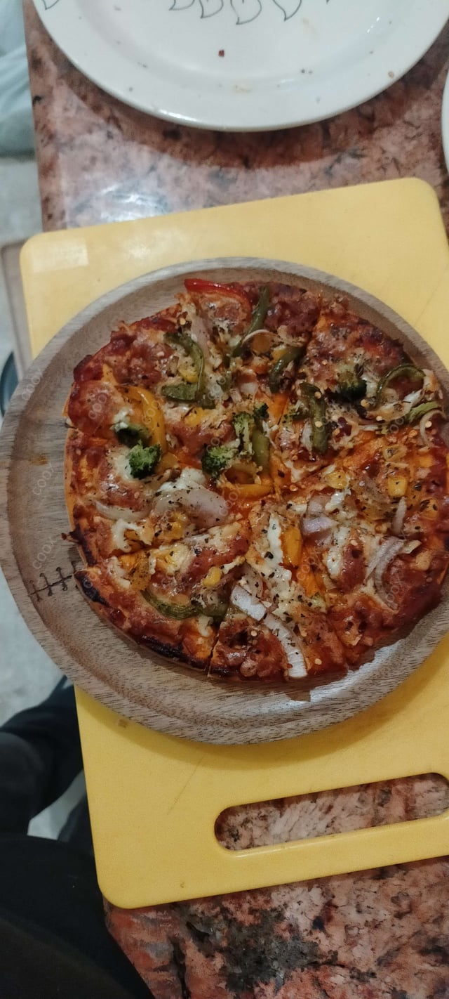 Delicious Veg Pizza prepared by COOX