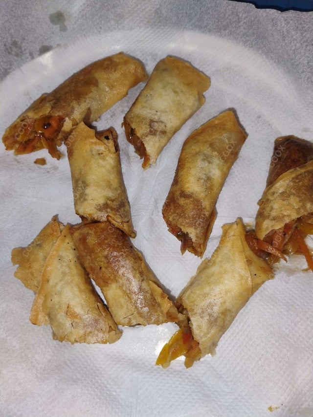 Delicious Veg Spring Rolls prepared by COOX