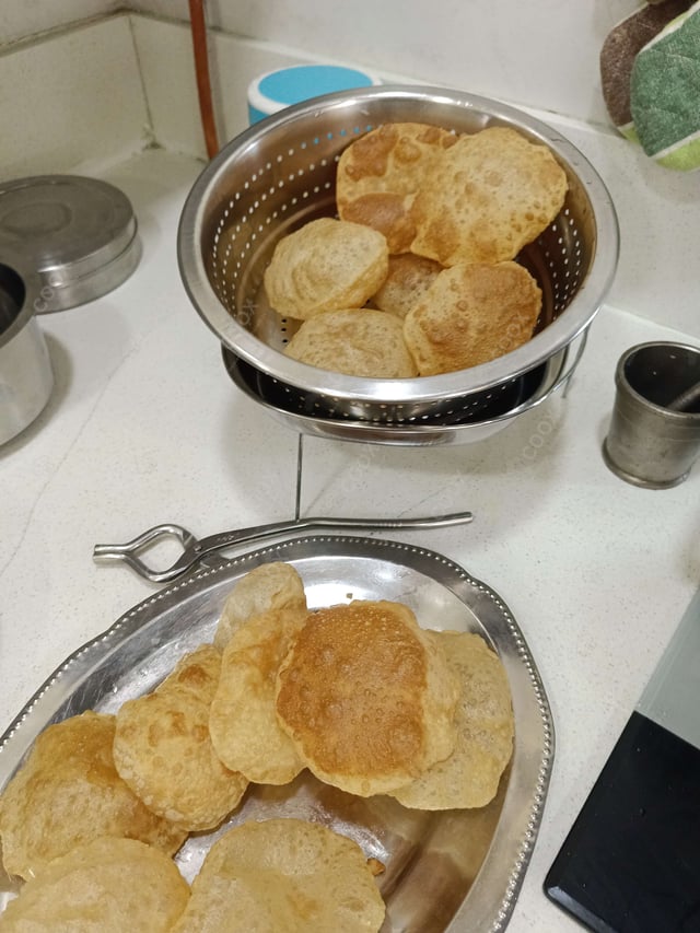 Delicious Pooris & Bedmis prepared by COOX