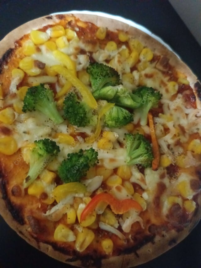 Delicious Veg Pizza prepared by COOX