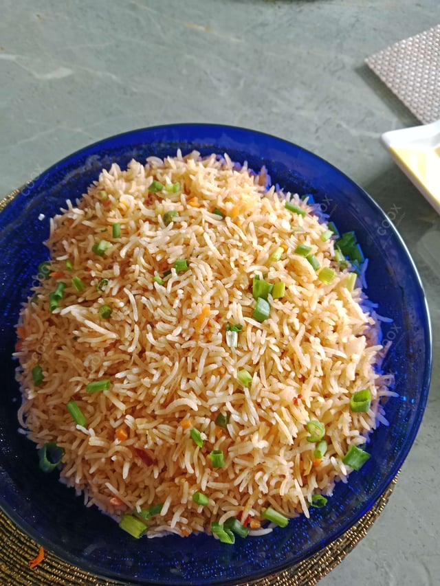 Delicious Schezwan Fried Rice prepared by COOX