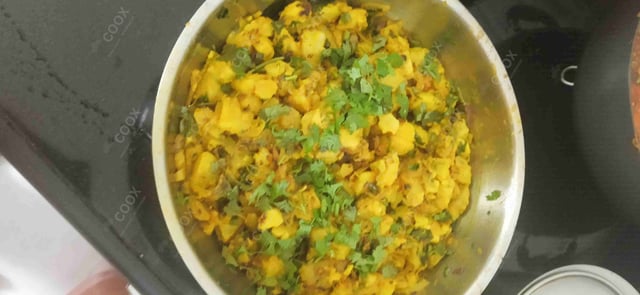 Delicious Jeera Aloo prepared by COOX