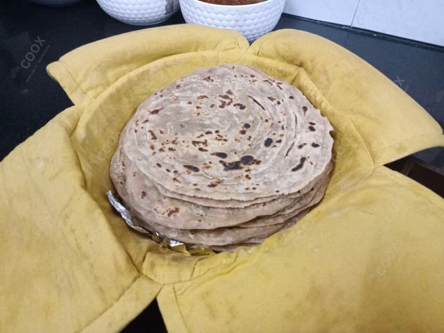 Delicious Lachha Parathas prepared by COOX