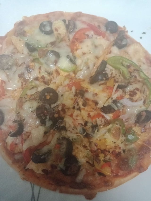 Delicious Veg Pizza prepared by COOX