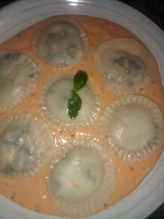 Delicious Ravioli in Pink Sauce prepared by COOX