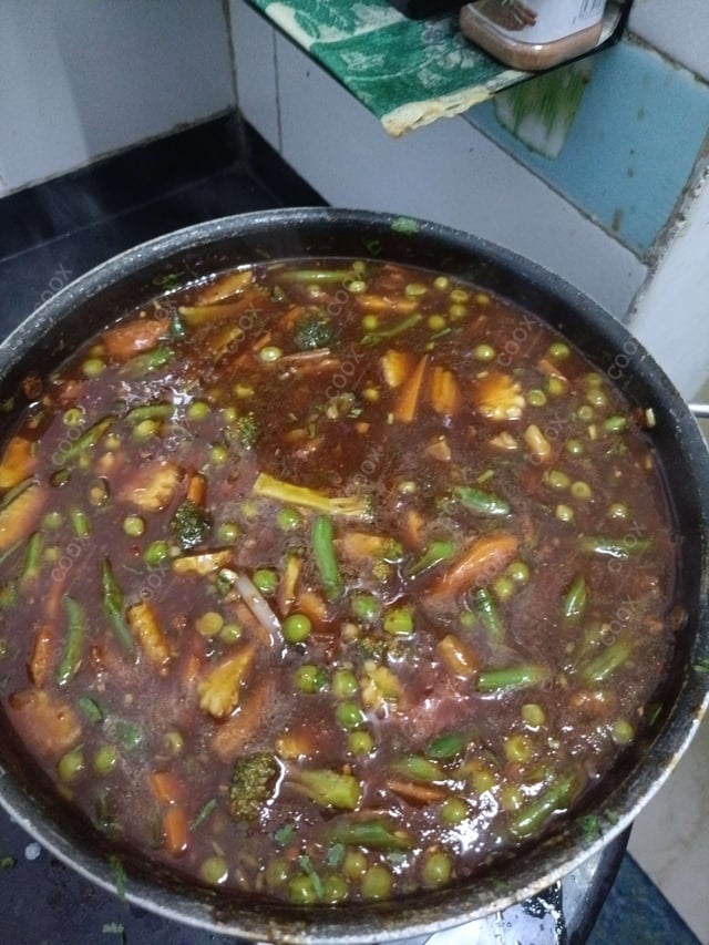 Delicious Mix Veg in Schezwan Sauce prepared by COOX