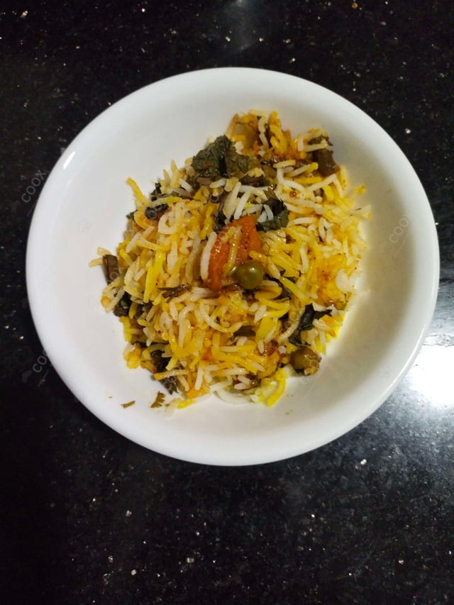 Delicious Veg Biryani prepared by COOX