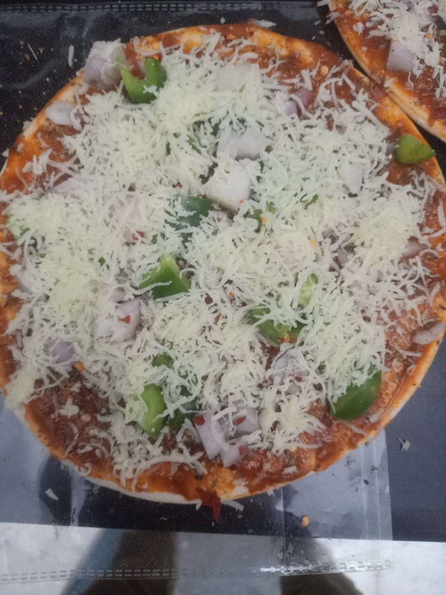 Delicious Veg Pizza prepared by COOX