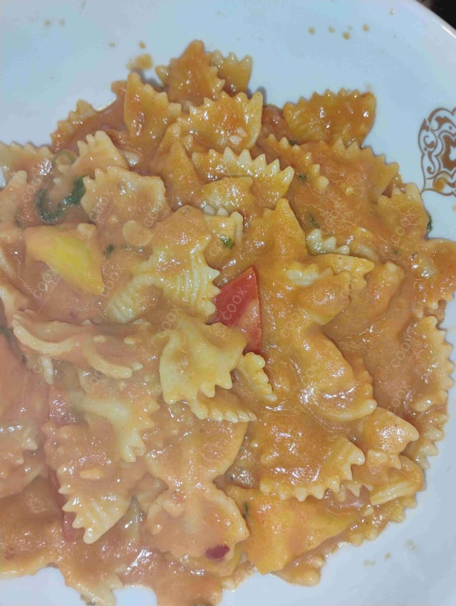 Delicious Ravioli in Pink Sauce prepared by COOX