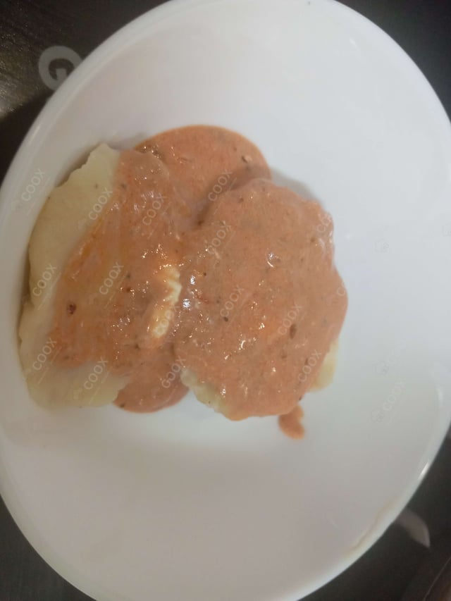 Delicious Ravioli in Pink Sauce prepared by COOX