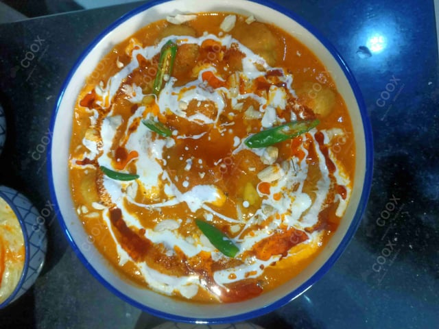 Delicious Malai Kofta (Orange Gravy) prepared by COOX