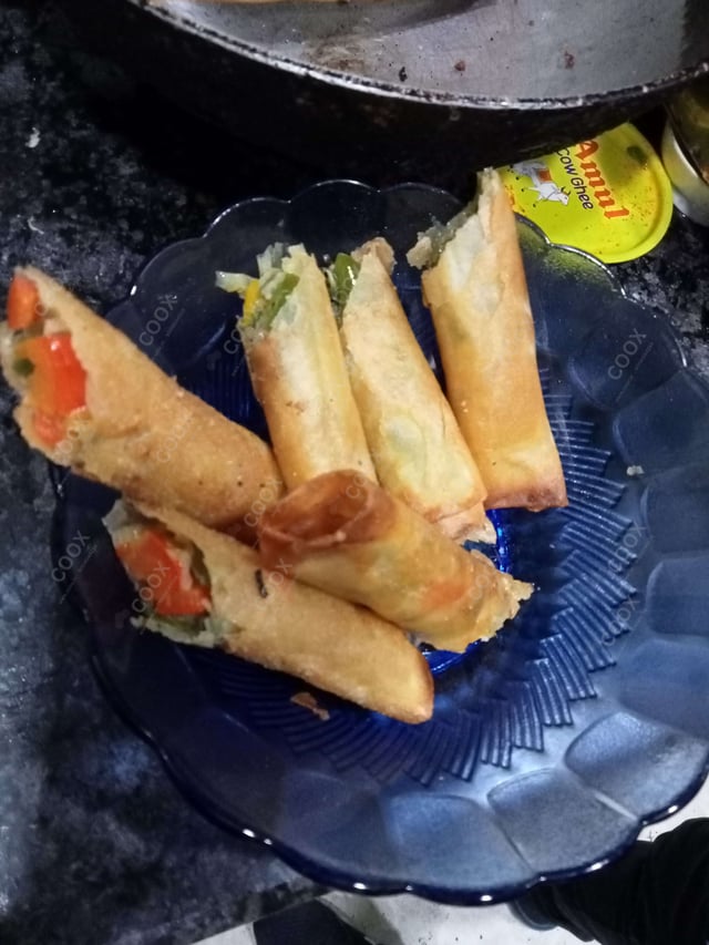 Delicious Veg Spring Rolls prepared by COOX