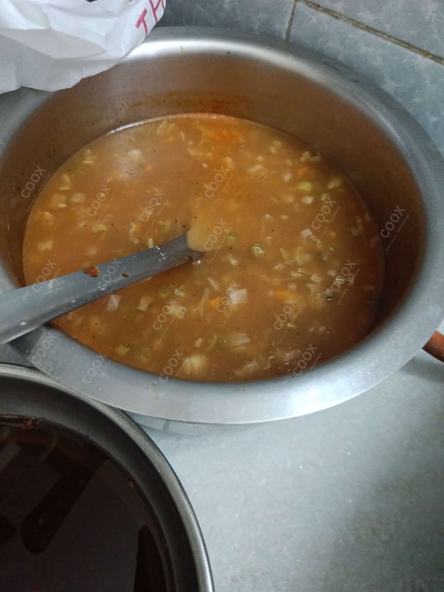 Delicious Vegetable Manchow Soup prepared by COOX