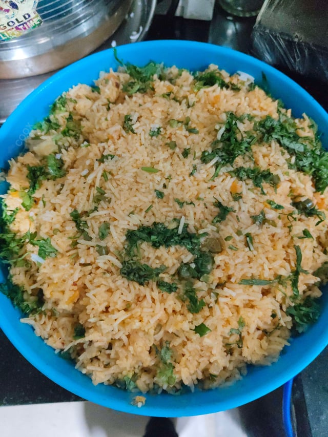 Delicious Schezwan Fried Rice prepared by COOX