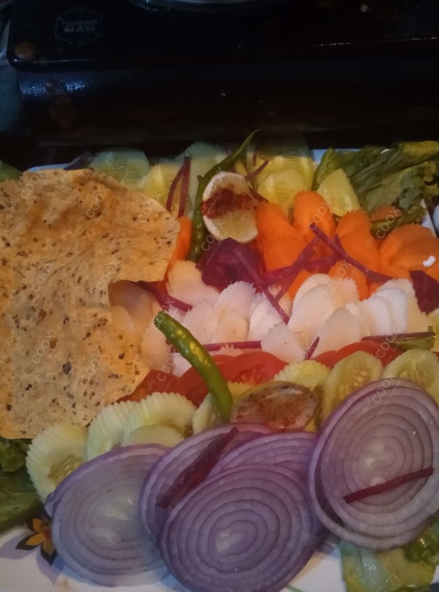 Delicious Salad, Raita, Papad prepared by COOX