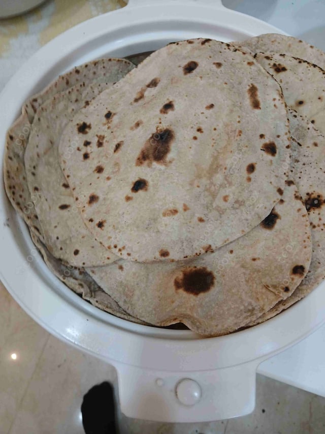 Delicious Tawa Rotis prepared by COOX