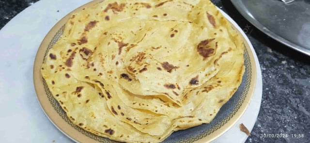 Delicious Lachha Paranthas prepared by COOX