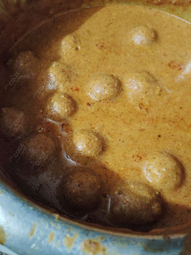 Delicious Malai Kofta (Orange Gravy) prepared by COOX