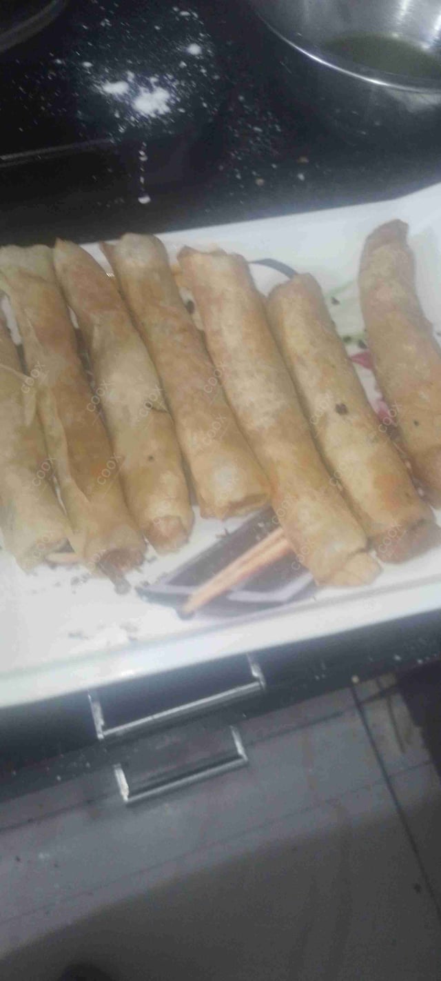 Delicious Veg Spring Rolls prepared by COOX