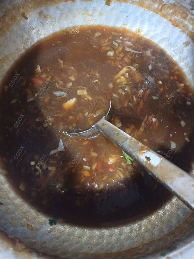 Delicious Vegetable Manchow Soup prepared by COOX