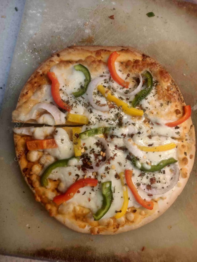 Delicious Veg Pizza prepared by COOX