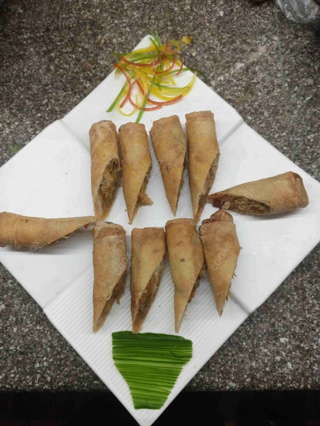 Delicious Veg Spring Rolls prepared by COOX