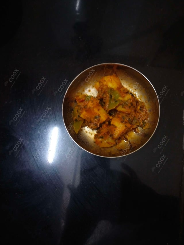 Delicious Aloo Shimla Mirch prepared by COOX