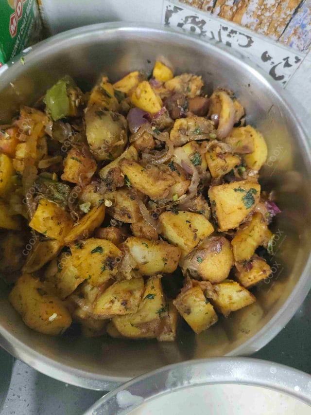 Delicious Jeera Aloo prepared by COOX