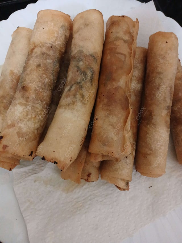 Delicious Chicken Spring Rolls prepared by COOX