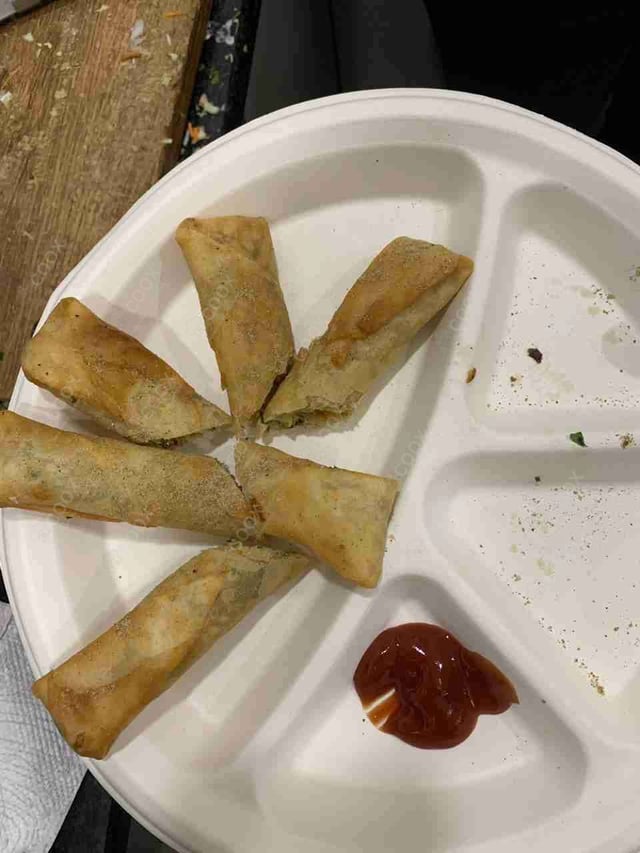 Delicious Veg Spring Rolls prepared by COOX