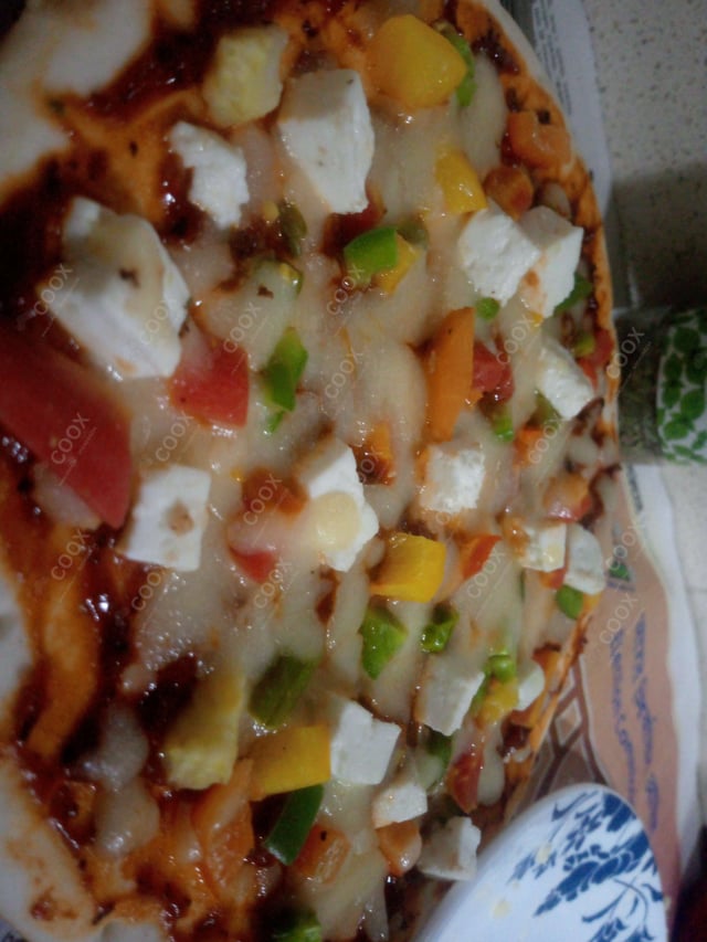 Delicious Veg Pizza prepared by COOX