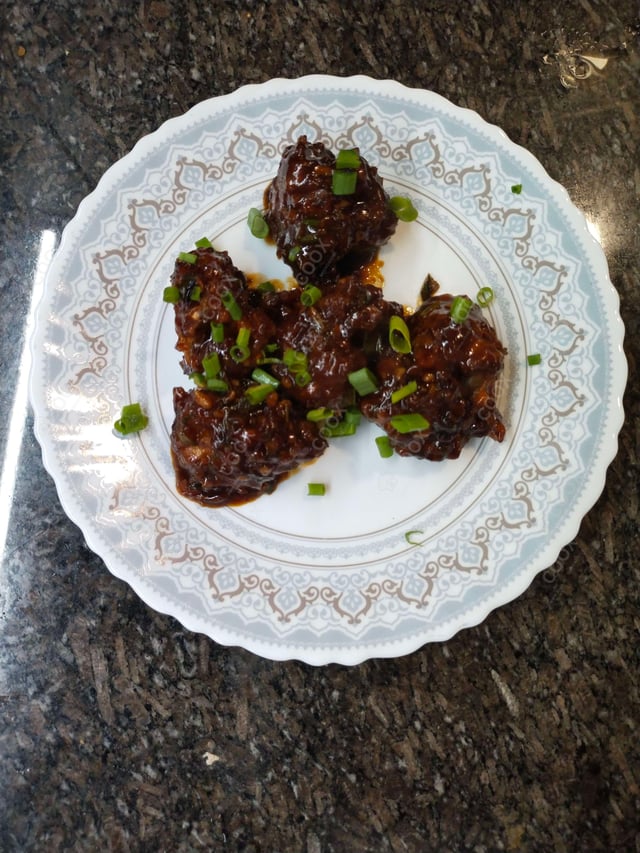 Delicious Veg Manchurian (Dry) prepared by COOX