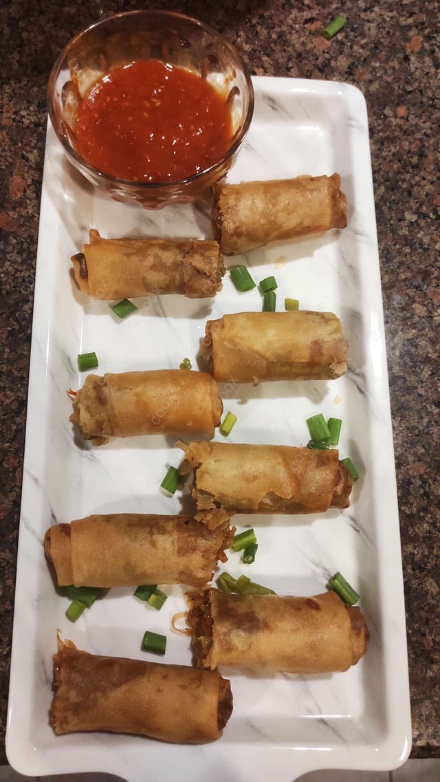 Delicious Veg Spring Rolls prepared by COOX