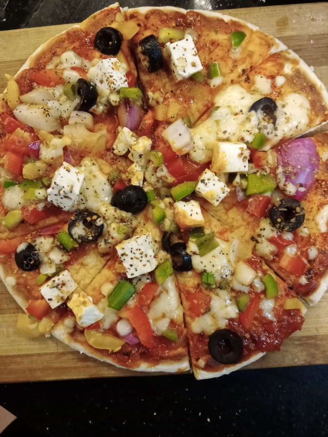 Delicious Veg Pizza prepared by COOX