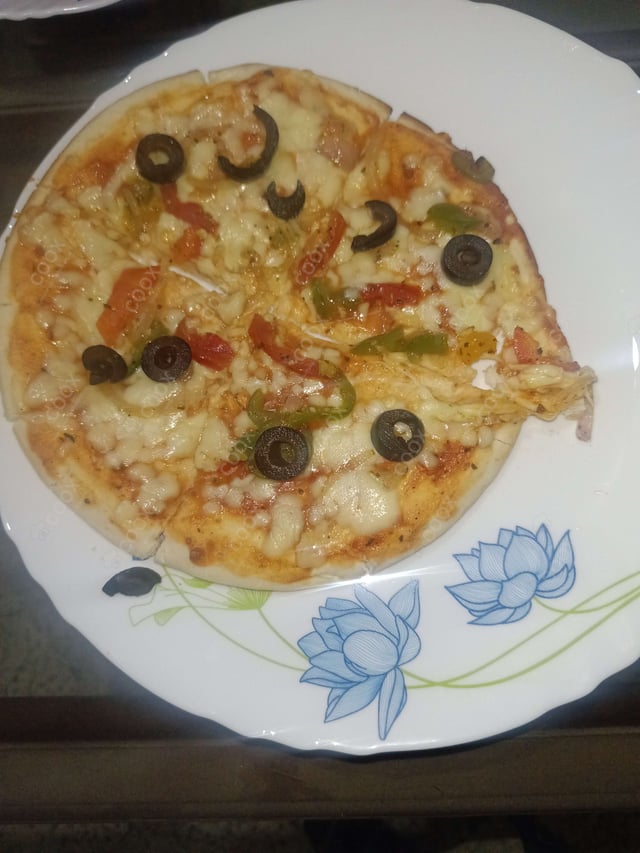 Delicious Veg Pizza prepared by COOX