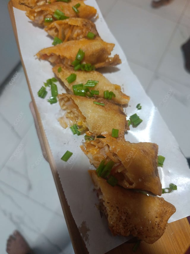 Delicious Veg Spring Rolls prepared by COOX