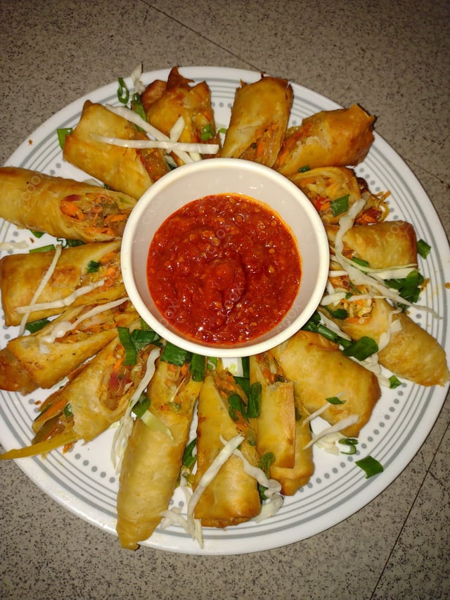 Delicious Veg Spring Rolls prepared by COOX