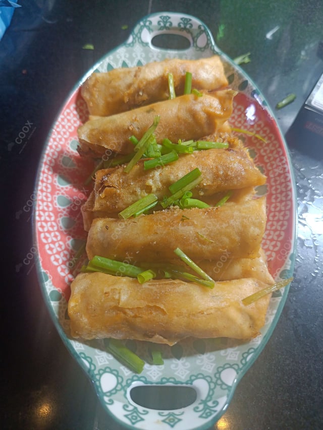 Delicious Chicken Spring Rolls prepared by COOX