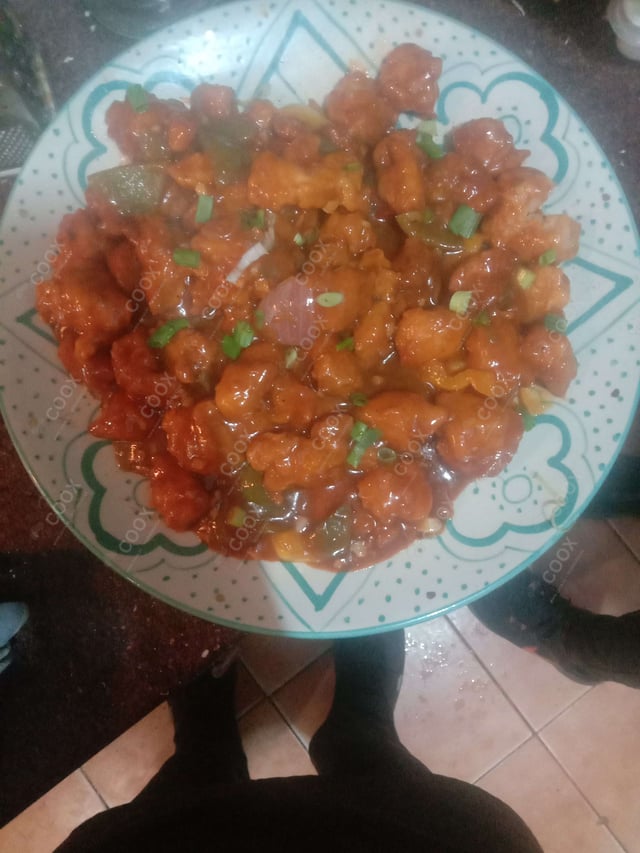 Delicious Kung Pao Chicken prepared by COOX