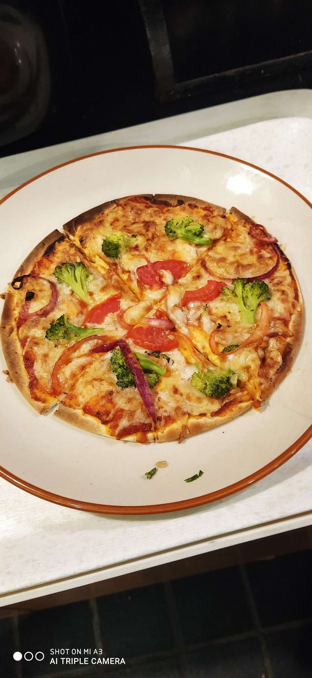 Delicious Chicken Pizza prepared by COOX