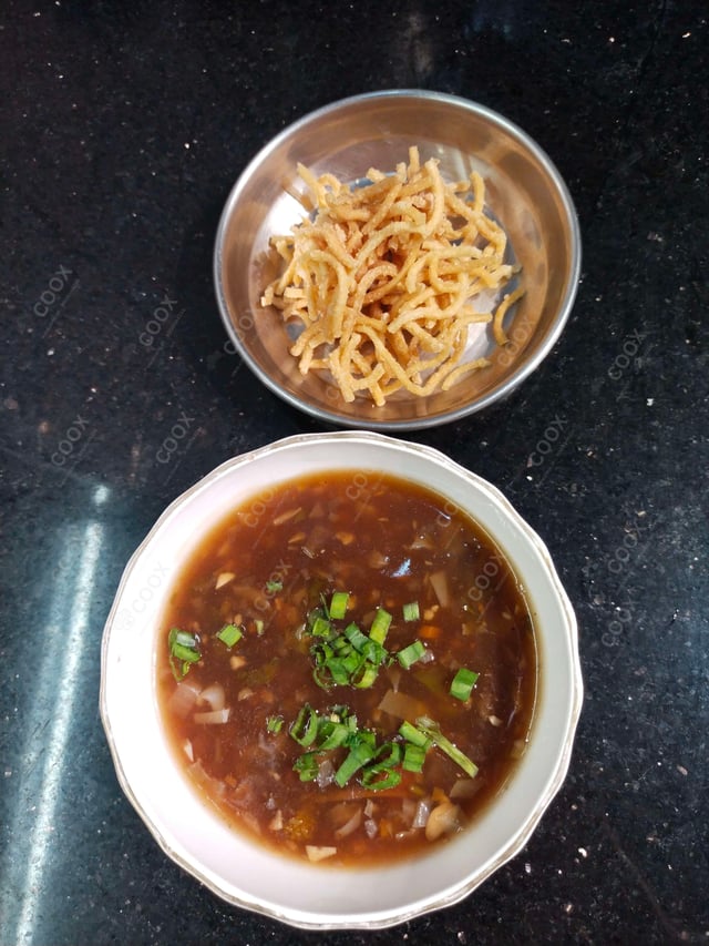 Delicious Vegetable Manchow Soup prepared by COOX