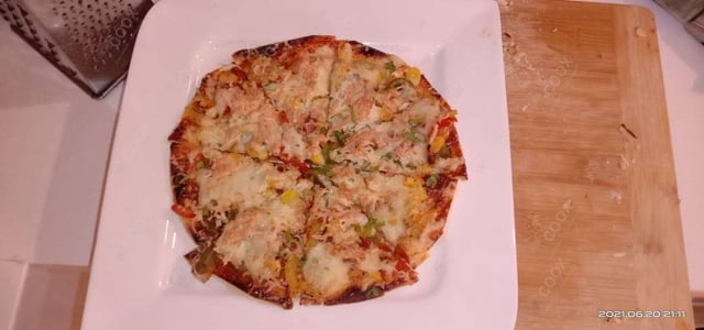 Delicious Veg Pizza prepared by COOX