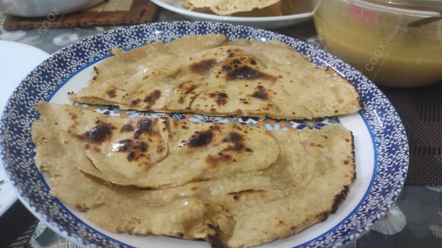 Delicious Lachha Parathas prepared by COOX