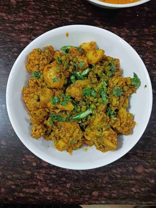 Delicious Gobhi Matar prepared by COOX