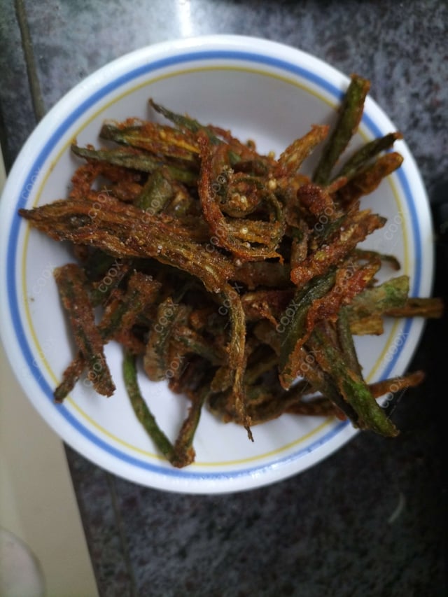 Delicious Kurkuri Bhindi prepared by COOX