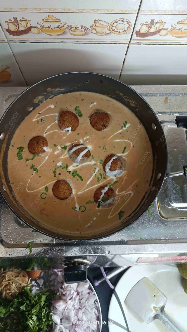 Delicious Malai Kofta (Orange Gravy) prepared by COOX