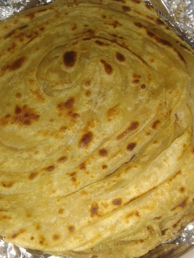 Delicious Lachha Parathas prepared by COOX