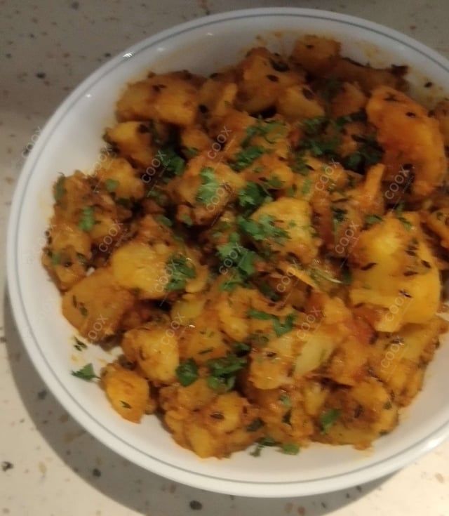 Delicious Aloo Rasedar prepared by COOX