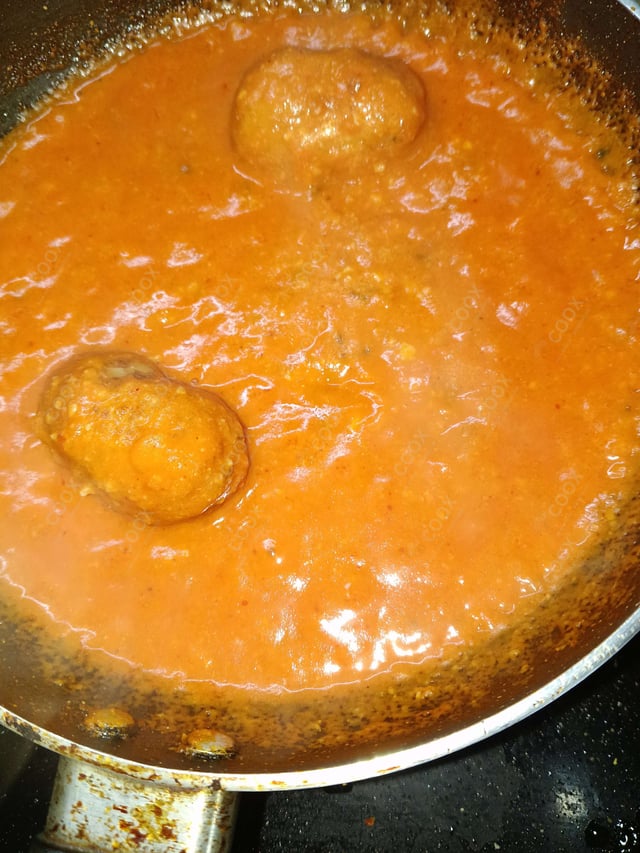 Delicious Malai Kofta (Orange Gravy) prepared by COOX